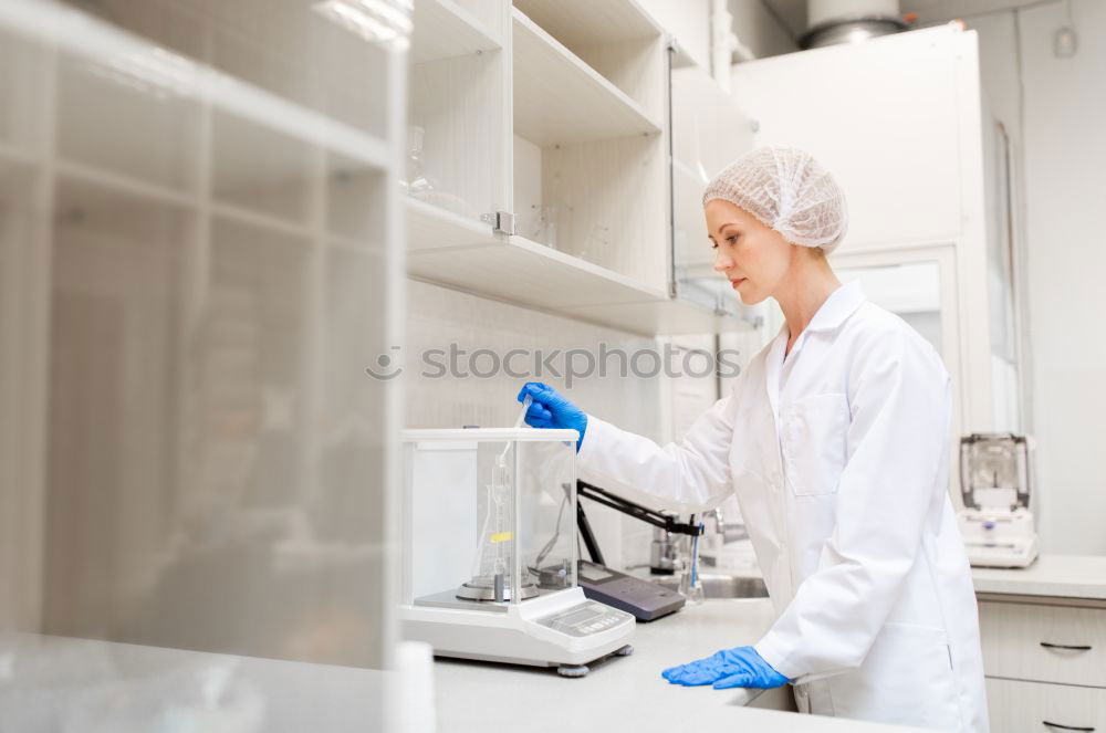 Similar – Worker putting liquid to test tube