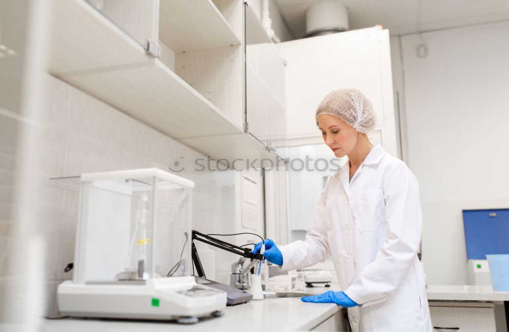 Similar – Image, Stock Photo Worker putting liquid to test tube