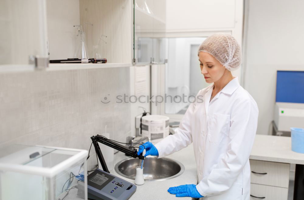 Similar – Image, Stock Photo Worker putting liquid to test tube