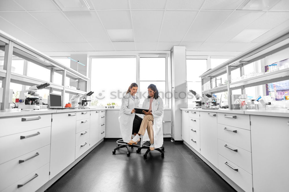 Similar – Image, Stock Photo Women standing and working in lab