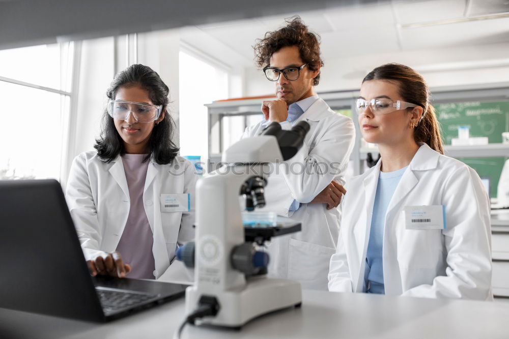 Similar – Image, Stock Photo Workers communicating in lab