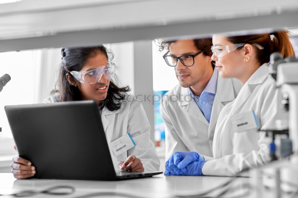 Similar – Image, Stock Photo Workers communicating in lab