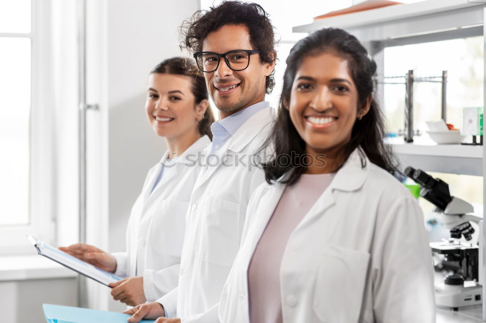 Similar – Image, Stock Photo Workers communicating in lab