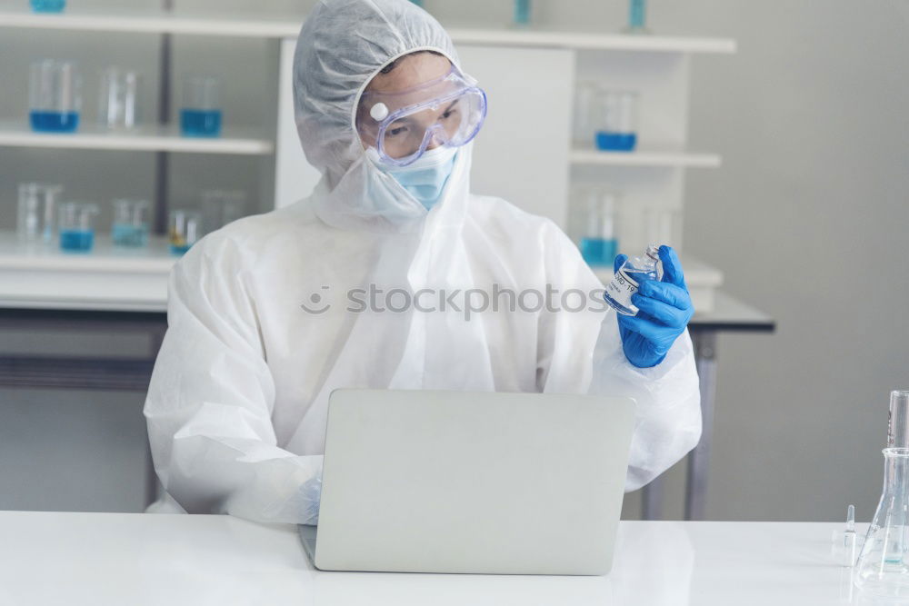 Similar – Image, Stock Photo Worker putting liquid to test tube