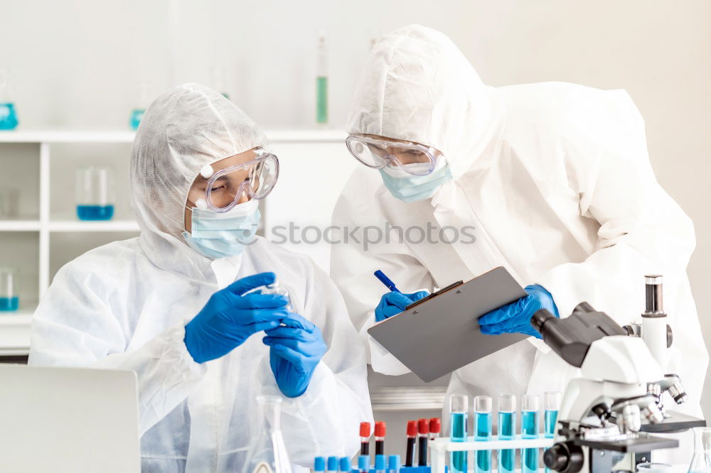 Similar – Image, Stock Photo Woman holding flask in lab