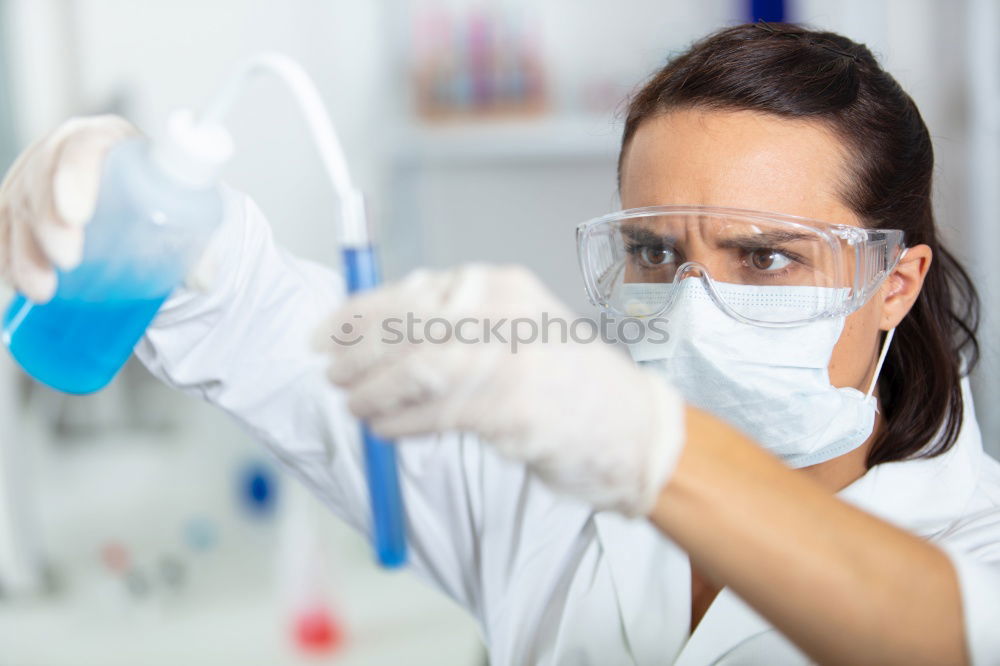 Similar – Image, Stock Photo Woman holding flask in lab