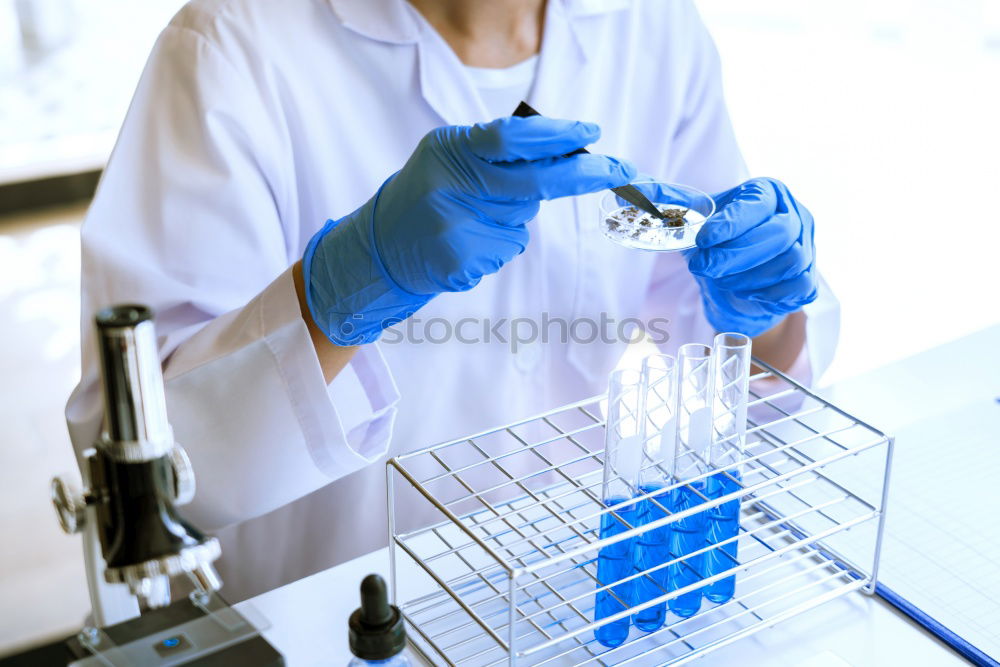 Similar – Image, Stock Photo Worker putting liquid to test tube