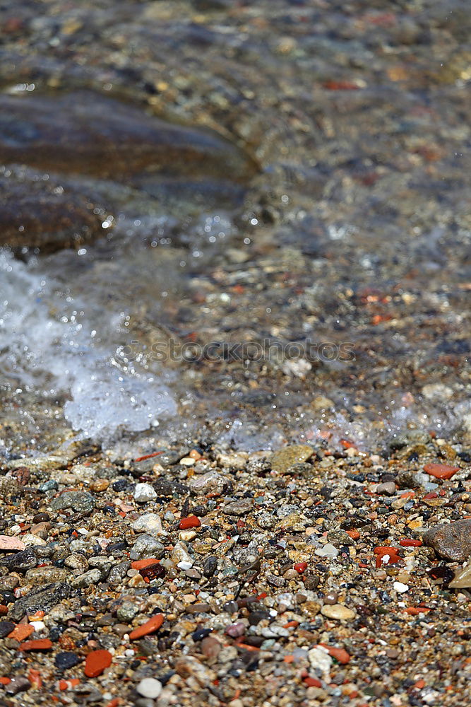 Similar – Stones in rust water Water