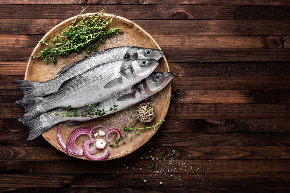 Similar – Image, Stock Photo Fish fillets with kitchen knife and spices