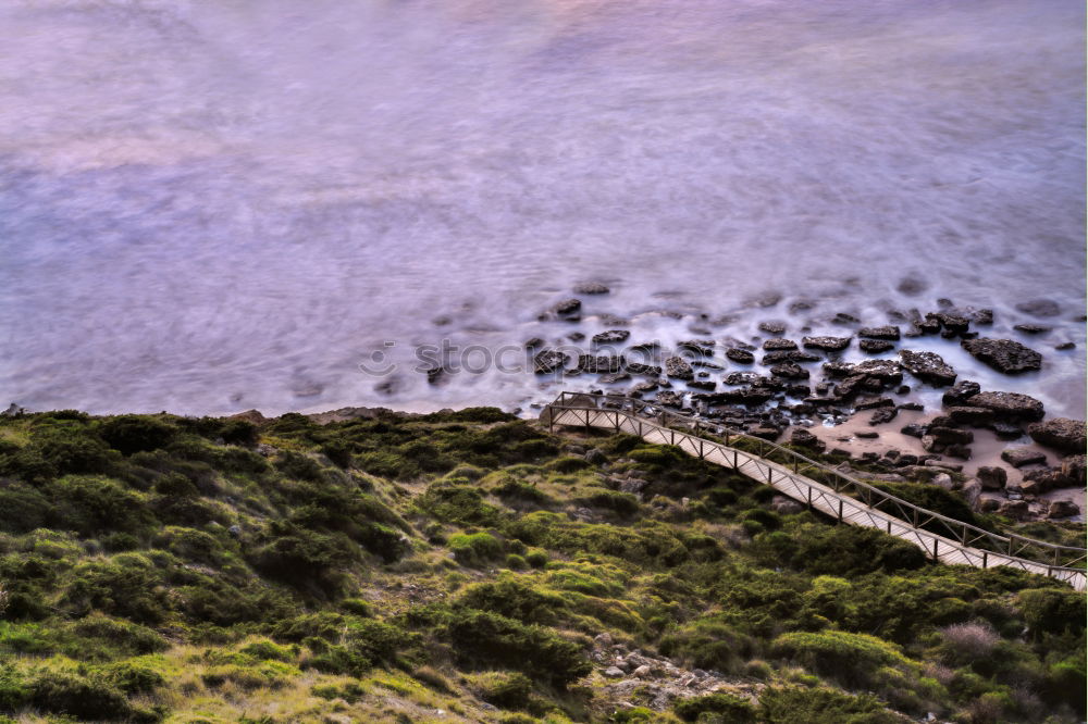 Similar – Image, Stock Photo Steep coast washed up by waves with a blue sky.