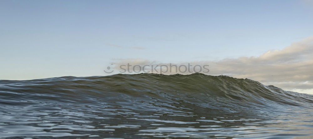 Similar – Surfer in wave Ocean Waves