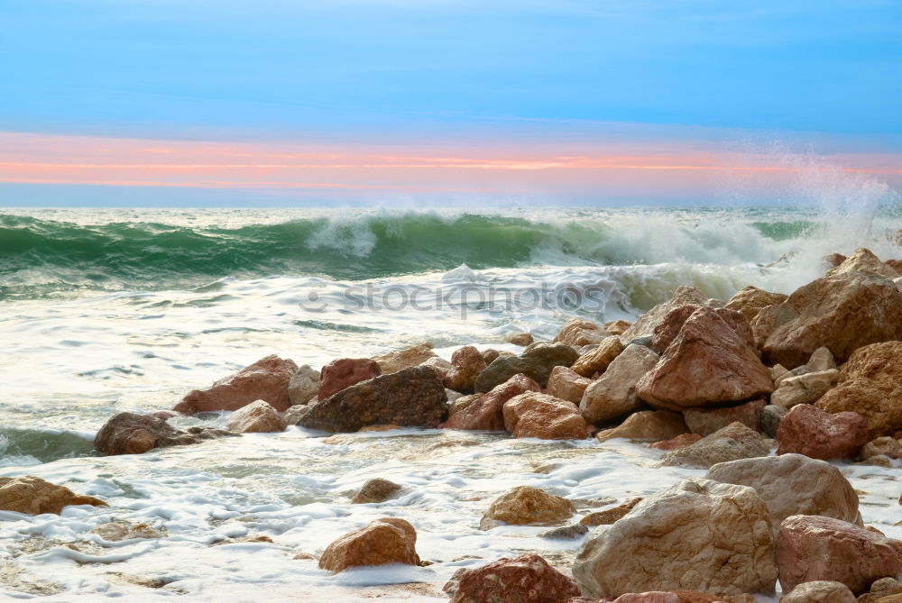 Similar – Rocks with spray in sunset in Portugal