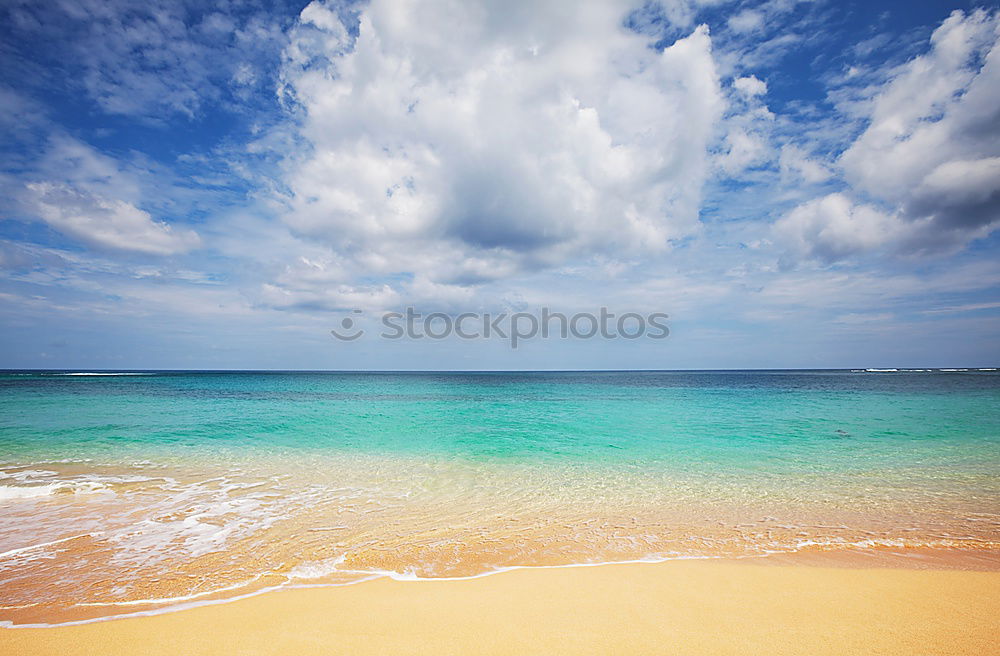 Similar – beach of sand with sun hat