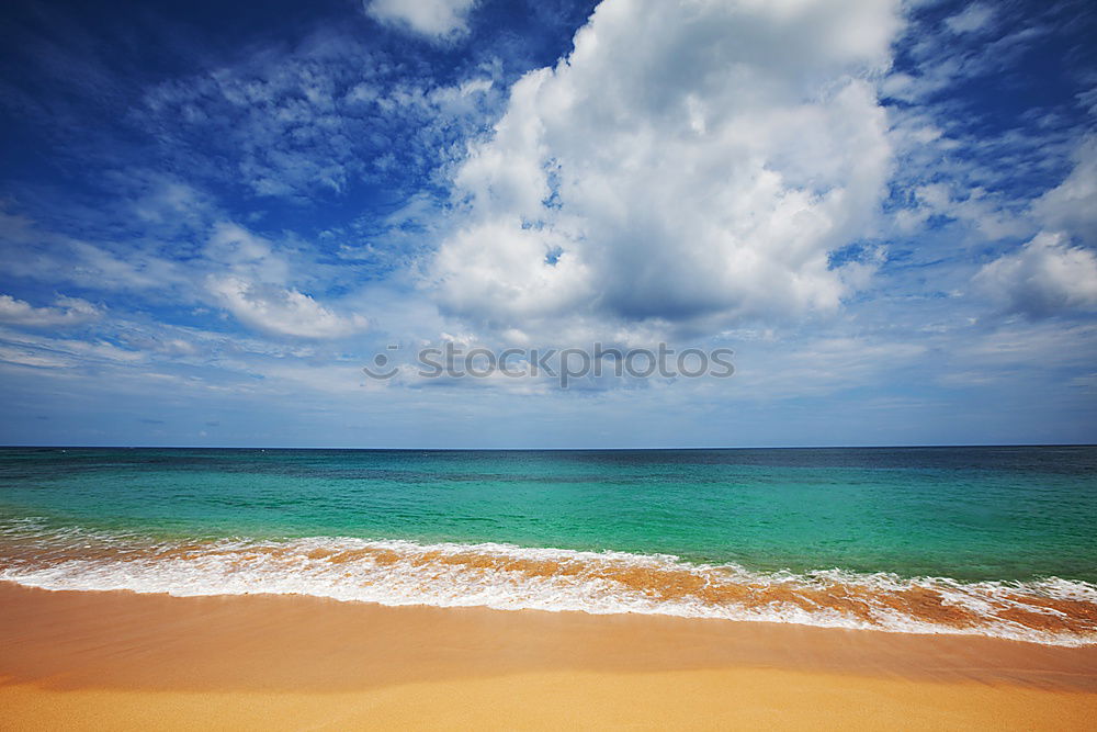 Similar – beach of sand with sun hat