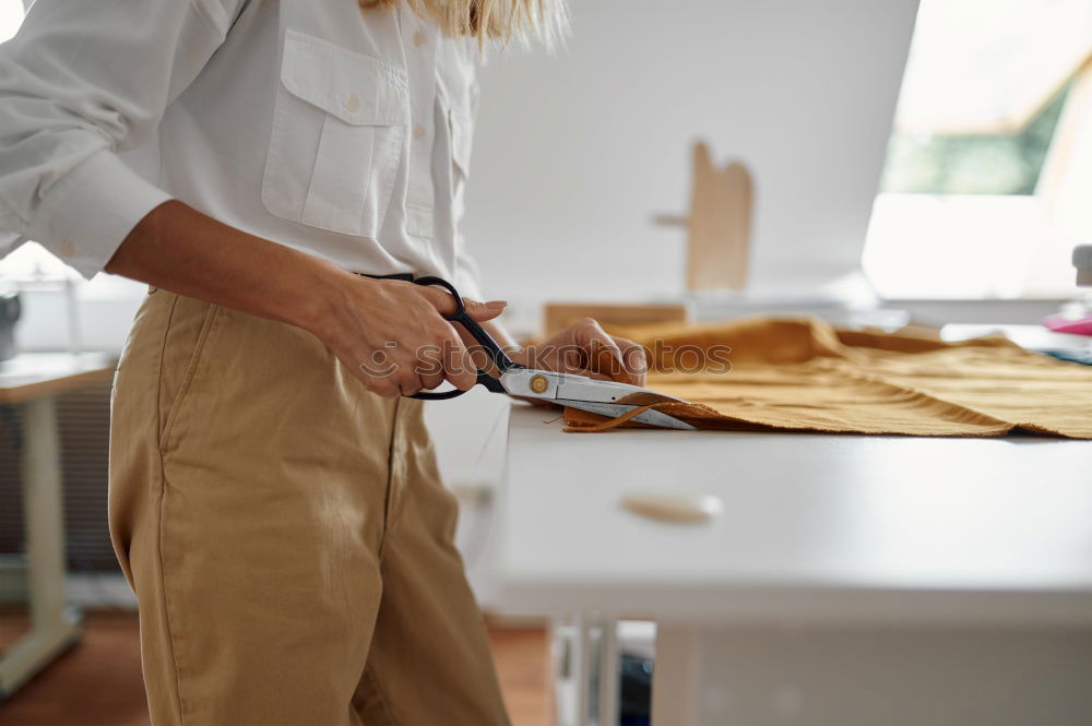 Similar – Image, Stock Photo Top view of woman working with sewing machine in her workshop