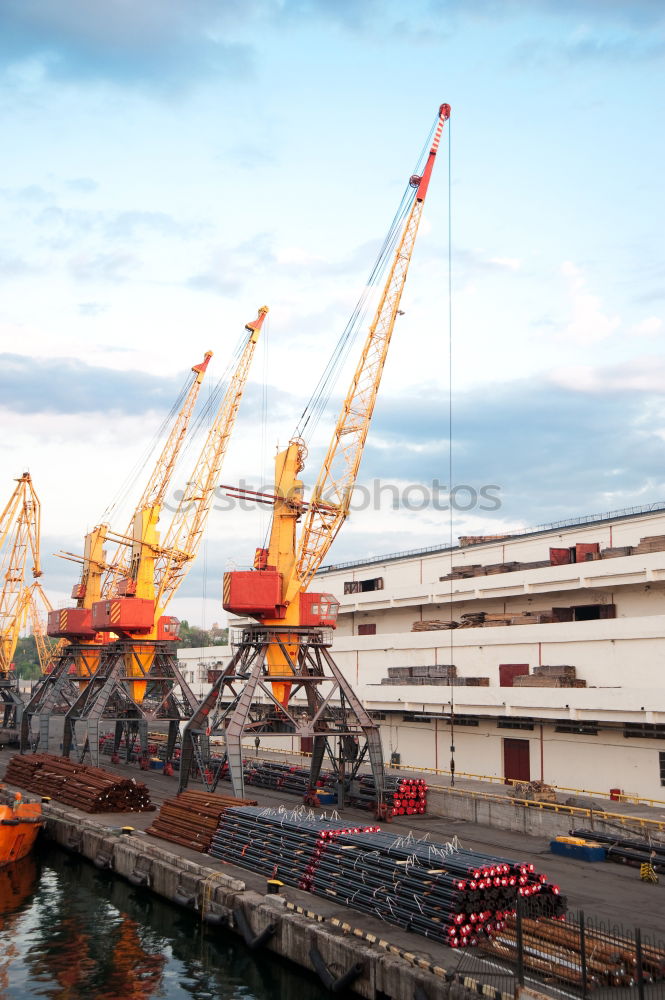 Similar – Pastel evening atmosphere at the harbor basin with cargo cranes