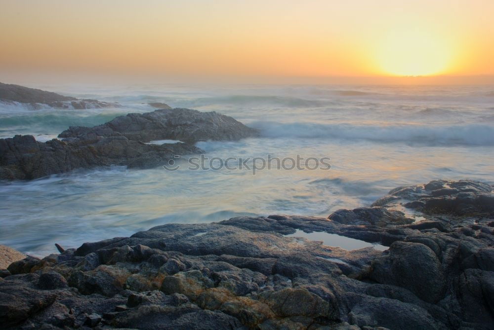 Similar – Rocks with spray in sunset in Portugal