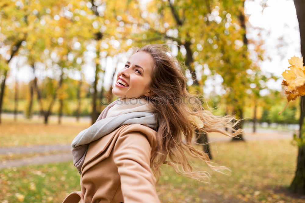 Similar – Young woman with moving hair wearing casual clothes