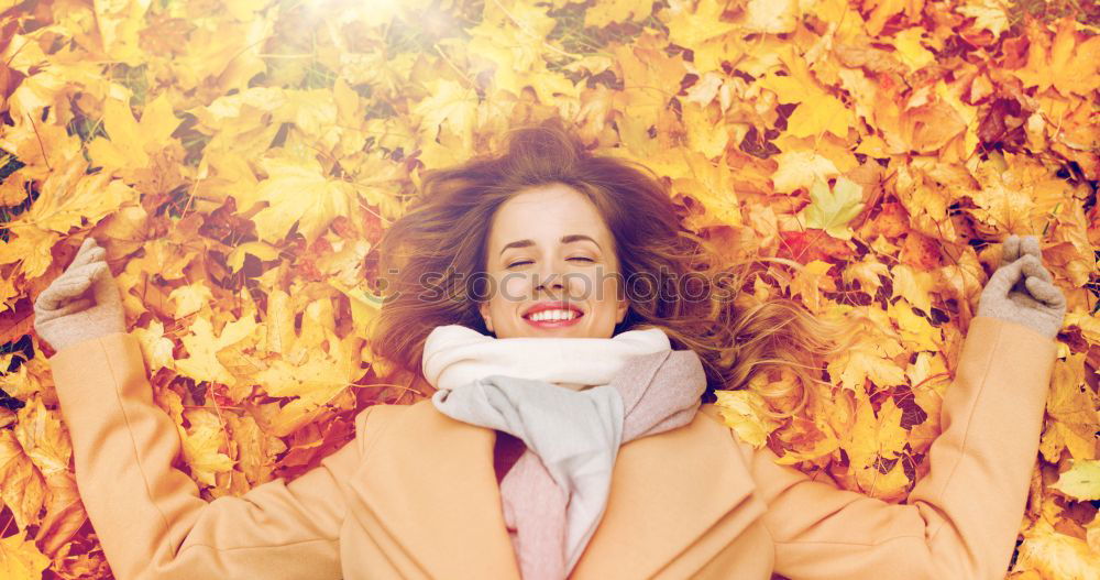 Similar – Image, Stock Photo Young woman lying down in the floor full of autumn leaves