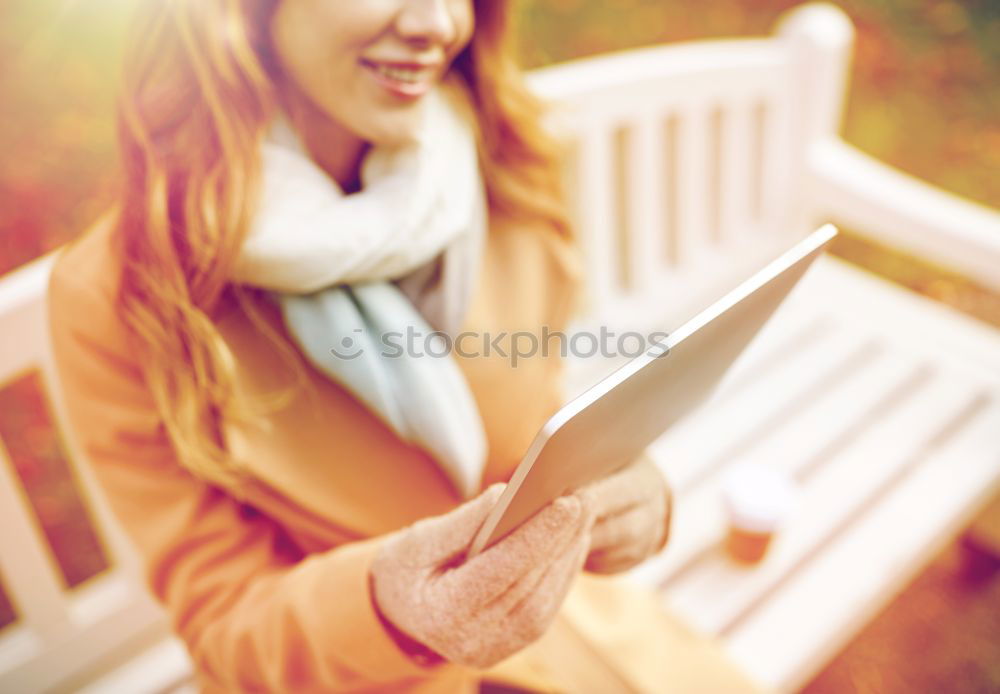 Similar – Woman reading a book outdoors