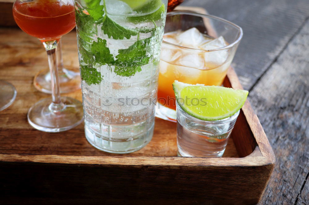 Similar – Two glasses of soft drink with honey- and watermelon, rosemary, ice cubes and drinking straw