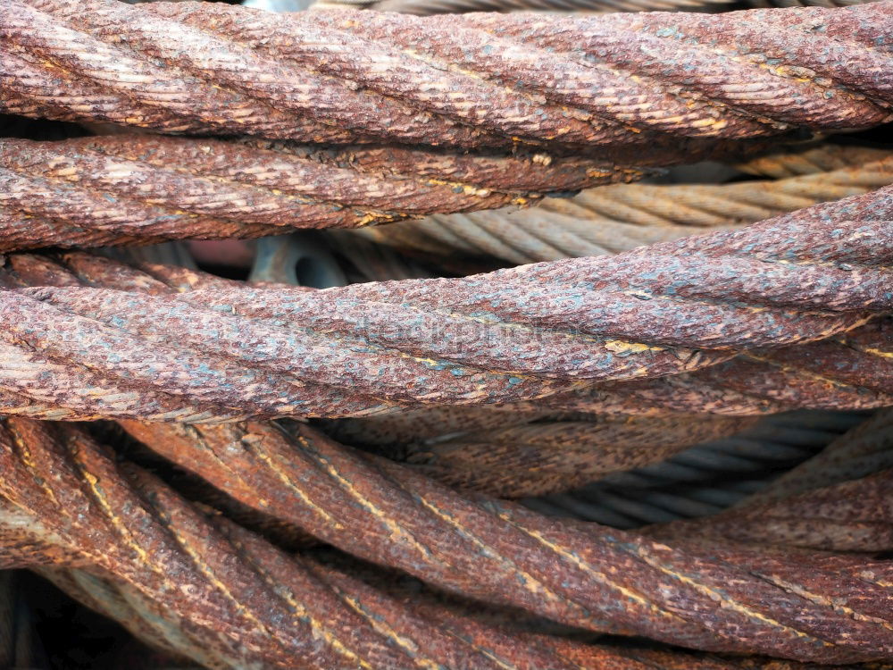 Similar – Rusty iron pipes wrapped with steel cable