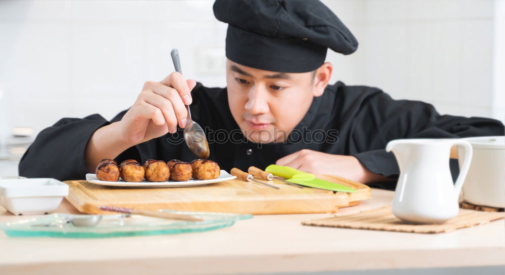 Similar – Closeup of woman chef cutting japanese sushi roll