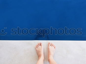 Similar – Man feet in the pool water