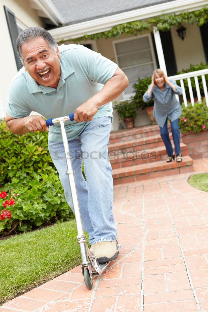 Similar – Image, Stock Photo Cheerful young man teaching his son to play mini golf