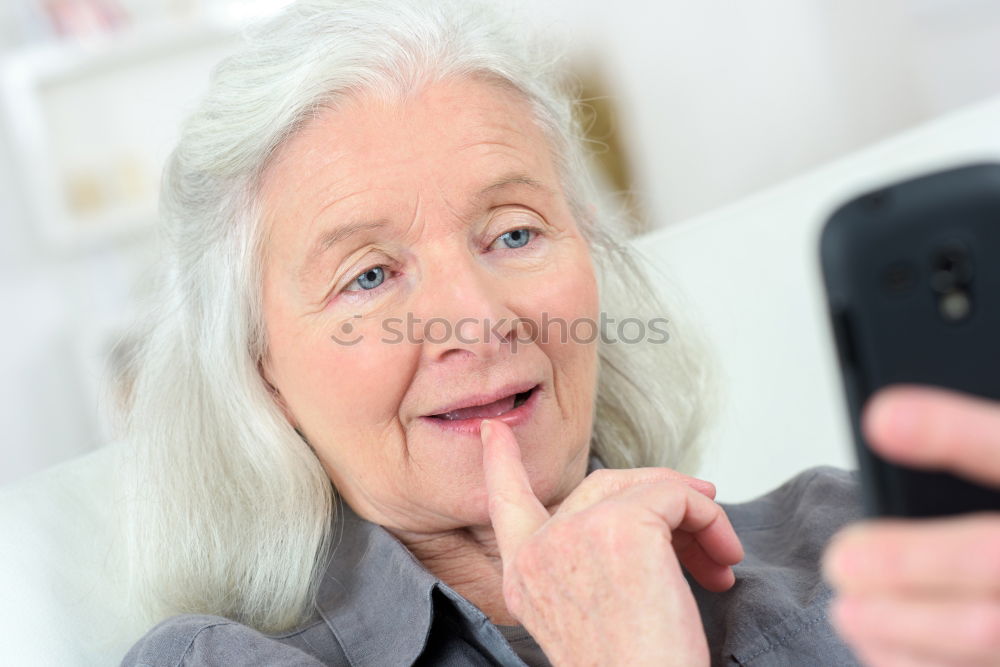 Similar – mature woman taking a selfie with smartphone