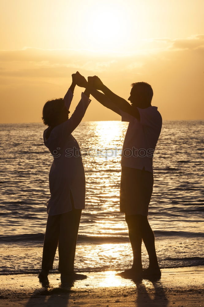 Similar – Image, Stock Photo Father and son playing on the beach at the sunset time. People having fun outdoors. Concept of happy vacation and friendly family.
