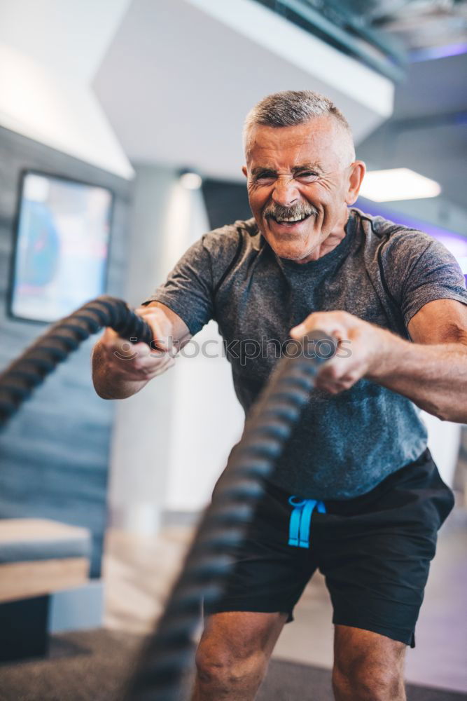 Similar – Image, Stock Photo Man stretching and woman doing dumbbells exercises in gym
