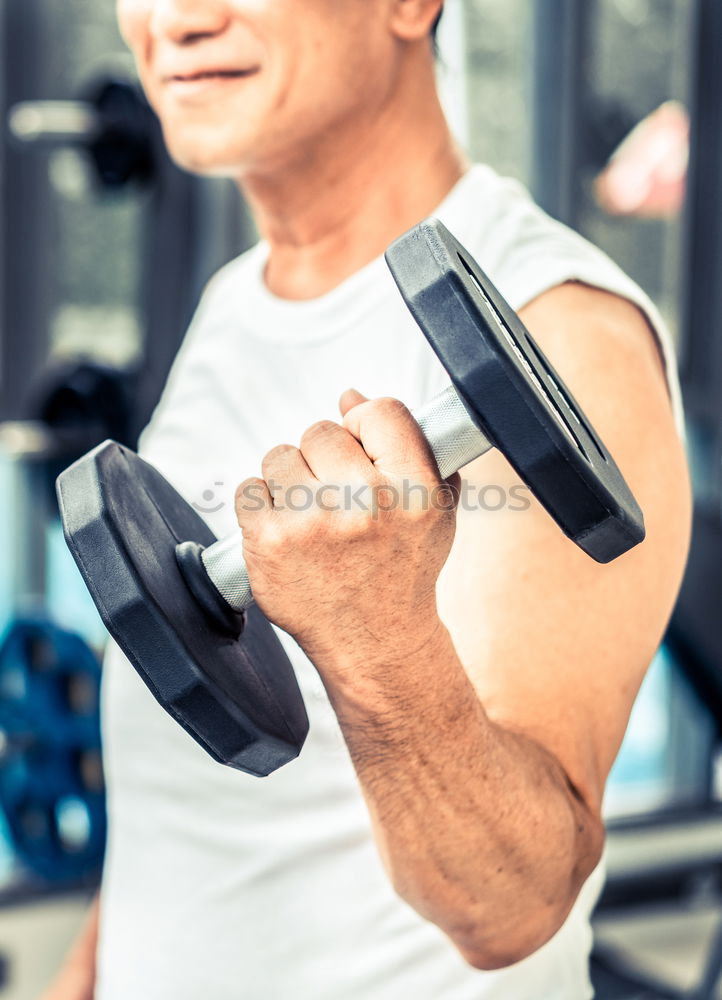 Image, Stock Photo Man stretching and woman doing dumbbells exercises in gym
