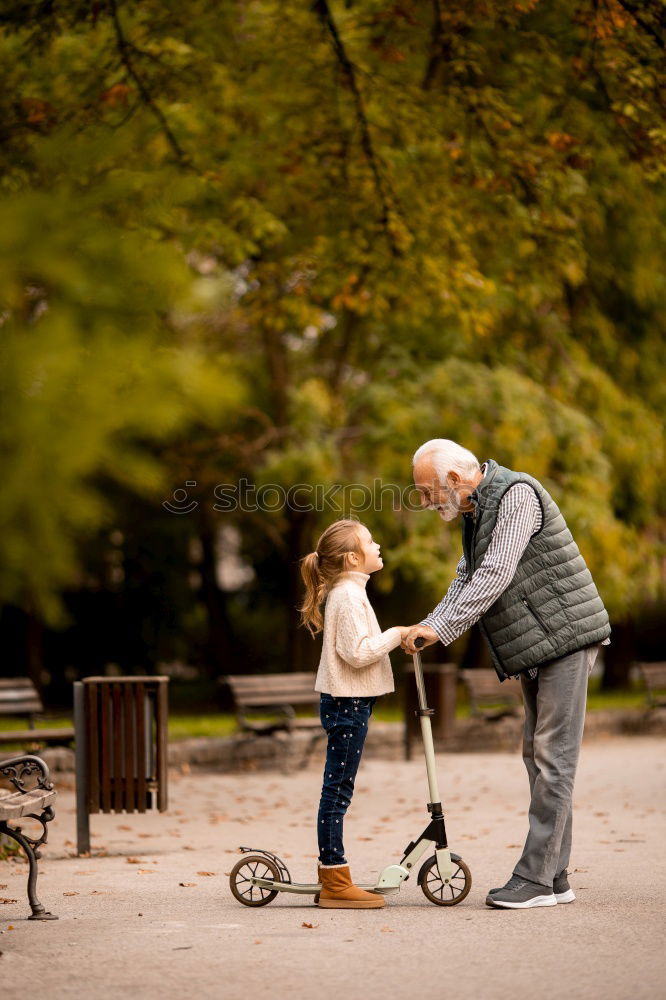 Similar – Image, Stock Photo Senior man and bored child reading newspaper outdoors