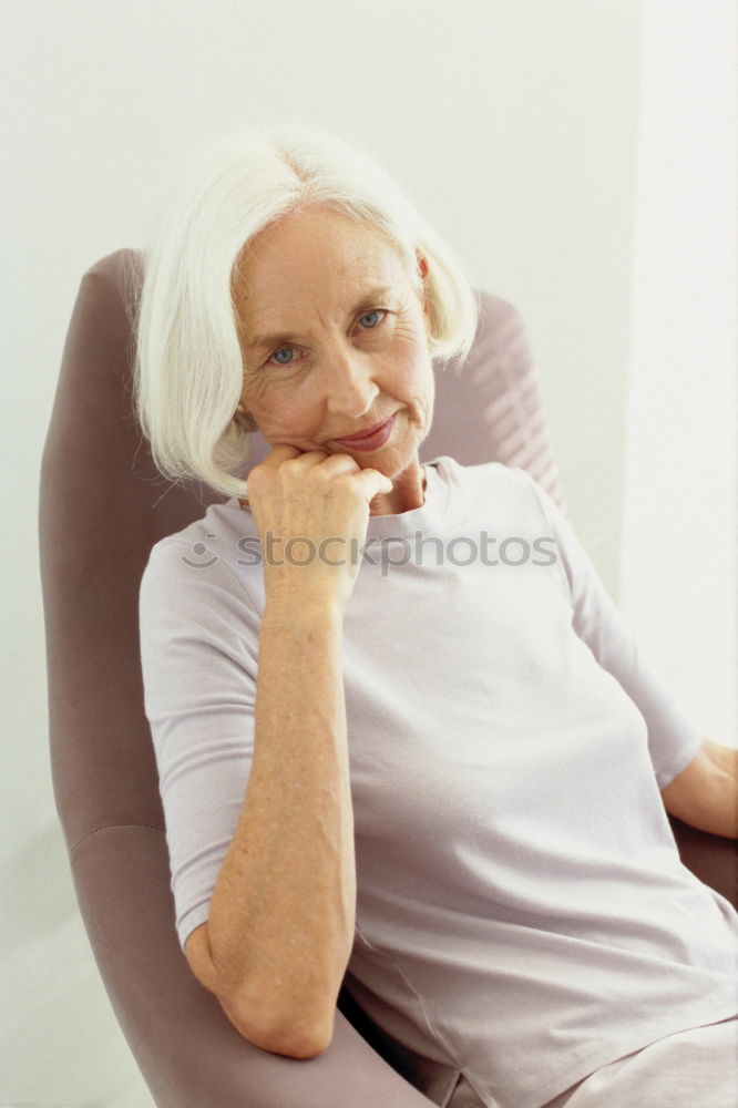 Similar – Image, Stock Photo Senior lady chatting to a younger woman smiling as they enjoy a few relaxing moments together in the living room