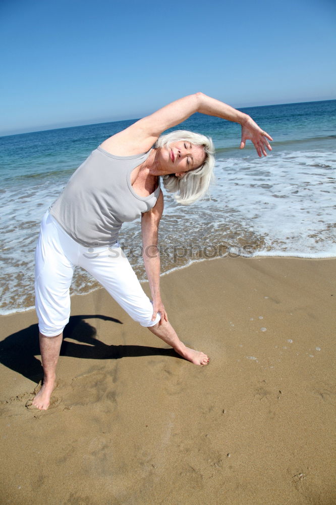 Similar – Image, Stock Photo Caucasian blonde woman practicing yoga in the beach