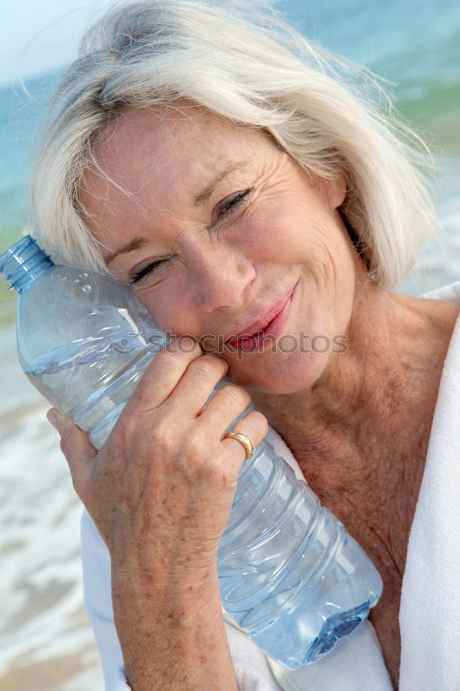 Similar – Senior old woman grey hair sitting by the swimming pool