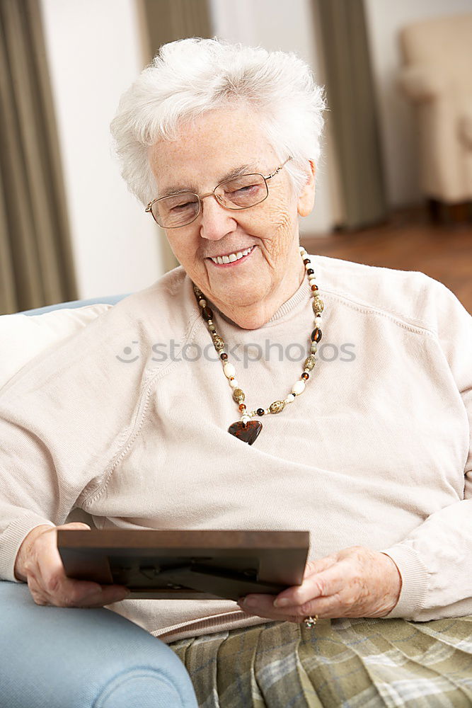 Similar – senior woman using smartphone