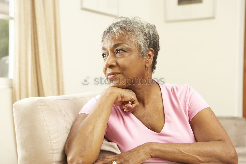 Similar – Image, Stock Photo Beautiful African woman from Togo with very short hair, slightly opened mouth, one earring with pearl in a white and pink striped fine shirt with collar from below in half profile