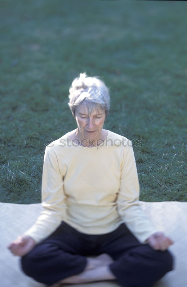 Similar – Image, Stock Photo blonde woman sitting in the grass and stretching in a park
