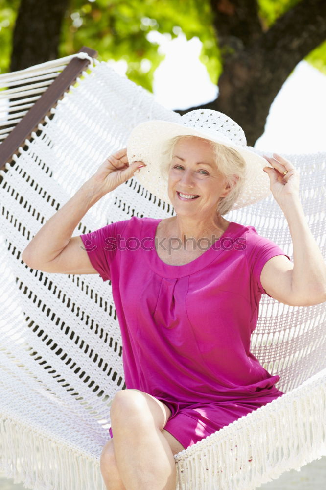 Similar – Senior old woman grey hair sitting by the swimming pool