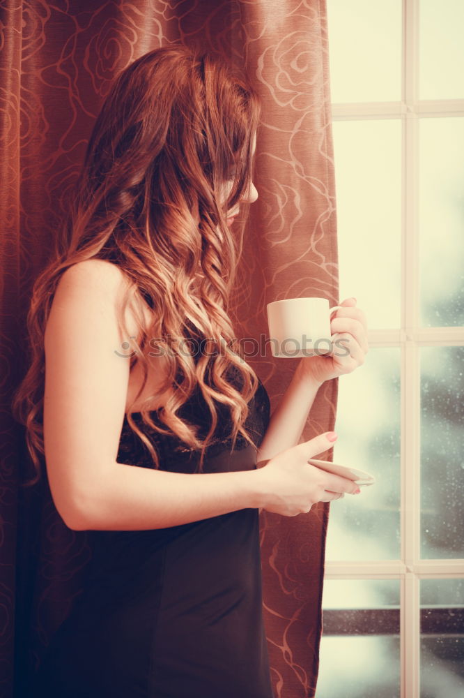 Similar – beauty girl sitting in a coffee shop with a cup in her hands