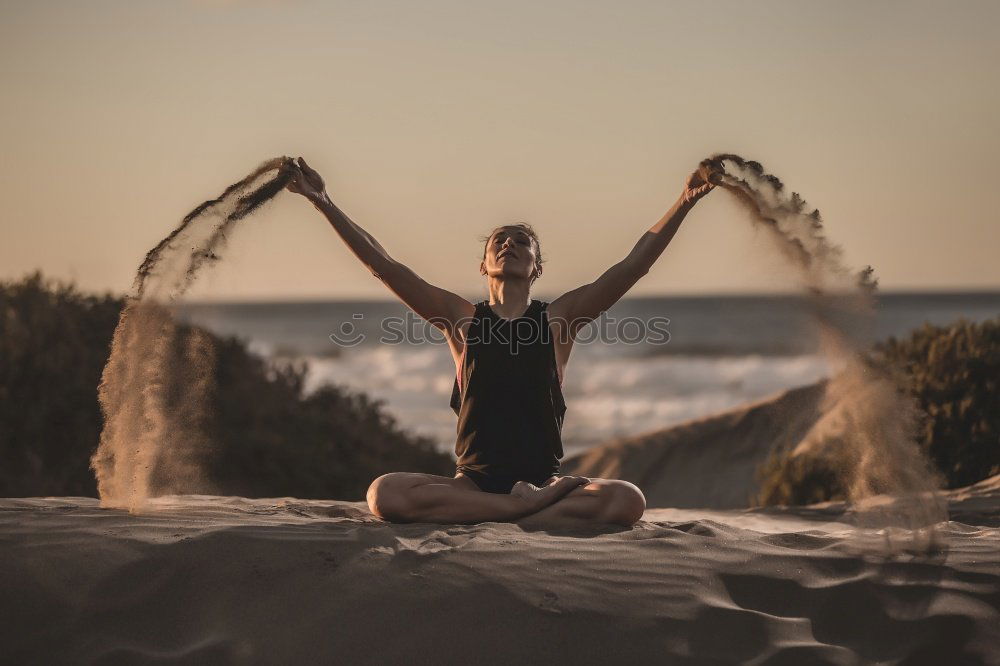 young woman doing yoga exercise outdoor