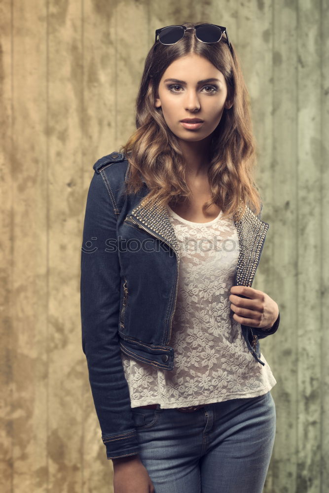 Similar – Woman in Winter Outfit in Front Old Gray Wall