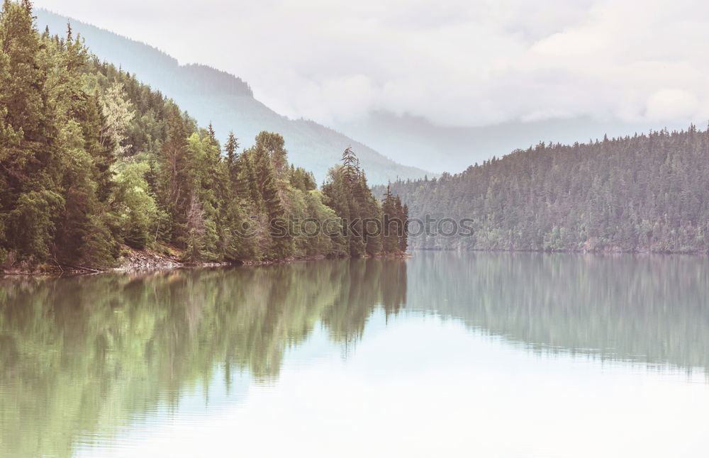 Similar – Pier on mountain lake Lake