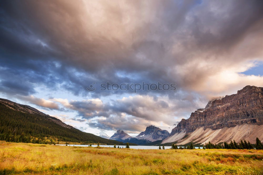 Similar – Snow-capped mountains and frozen river