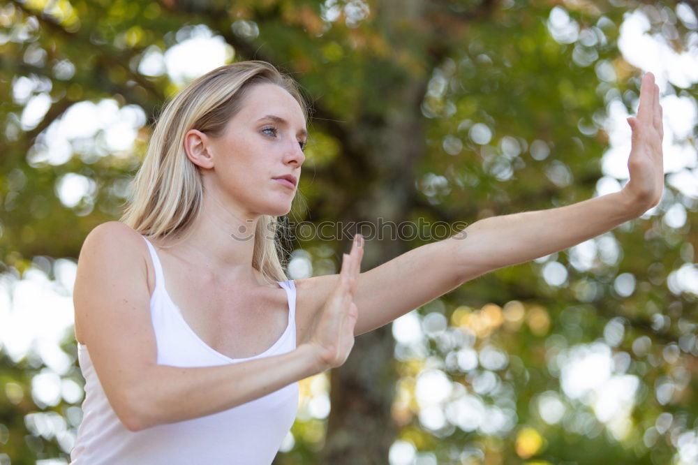 Similar – Beautiful young woman meditates in yoga asana Padmasana