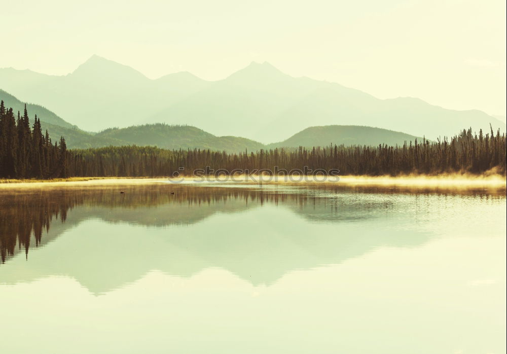 Similar – mountain range reflected in Barmsee lake, Germany