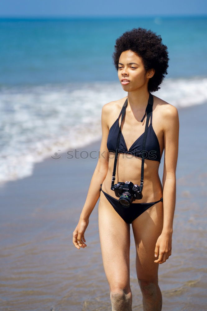 Similar – Image, Stock Photo Happy beautiful young woman wearing a swimming suit in a wooden foot bridge at the beach