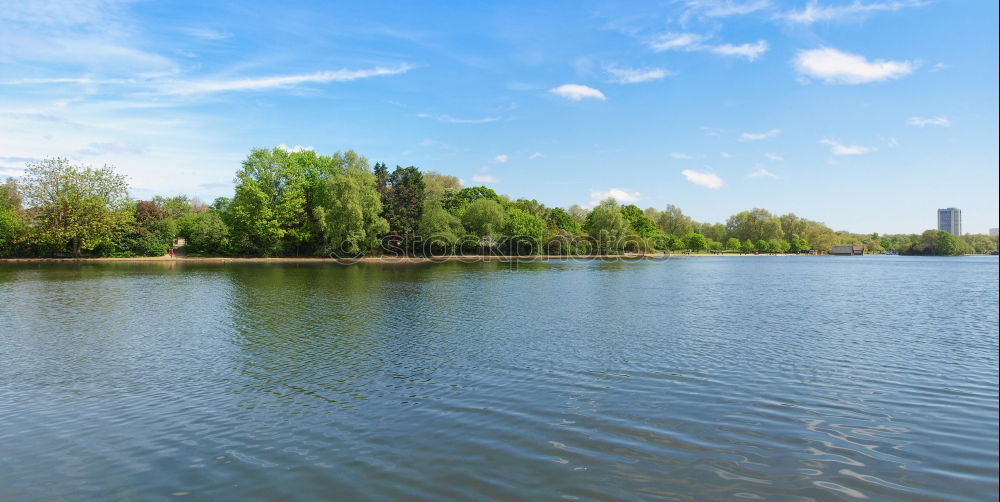 Tranquil, calm Rhine river scene with arched bridge